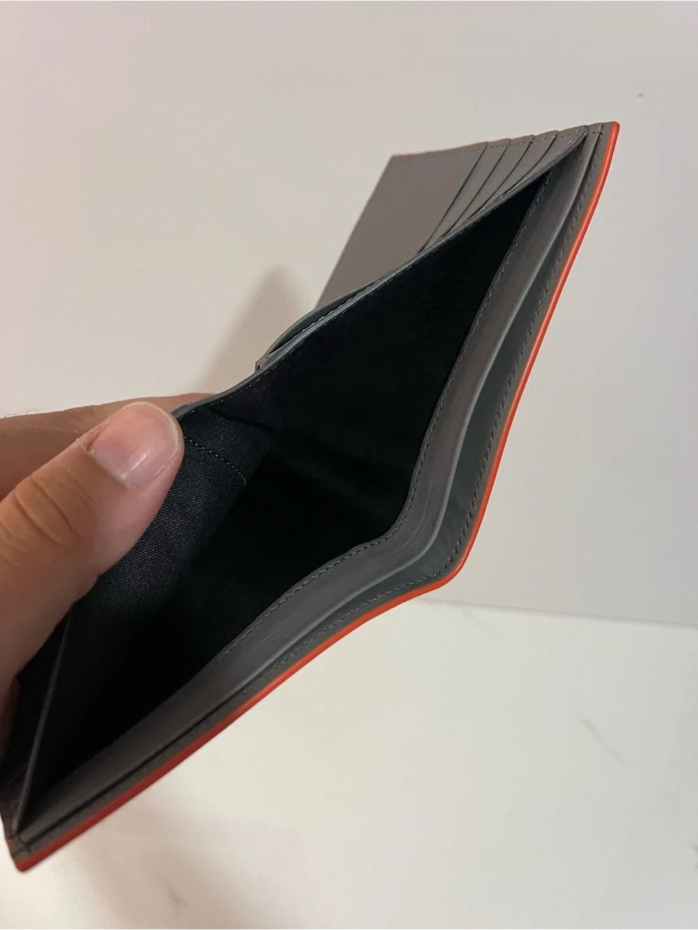 Fendi Gray Leather Embossed Face Bi-Fold Wallet with Orange Trim